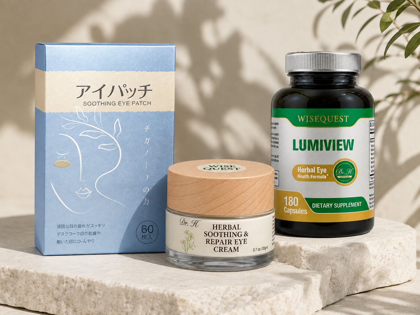 WiseQuest eye care trio — eye patches, eye cream and LUMIVIEW capsules on a stone slab